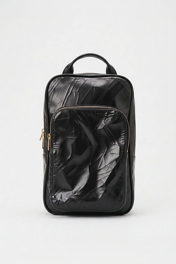 Black leather backpack on a white background