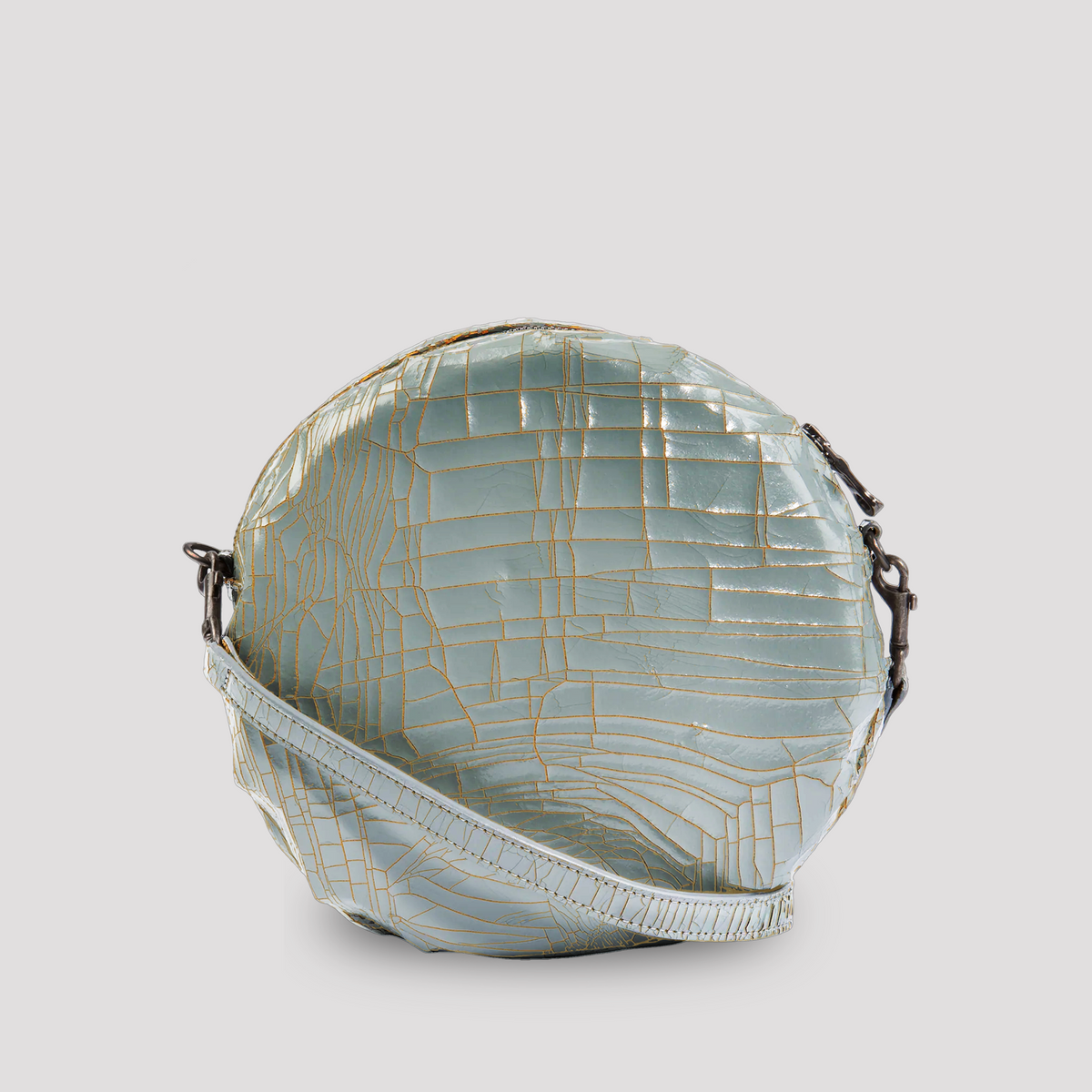 Baby blue baby macaron from Marc Marmel with smooth, round shell and creamy filling, perfect for dessert or gift.
