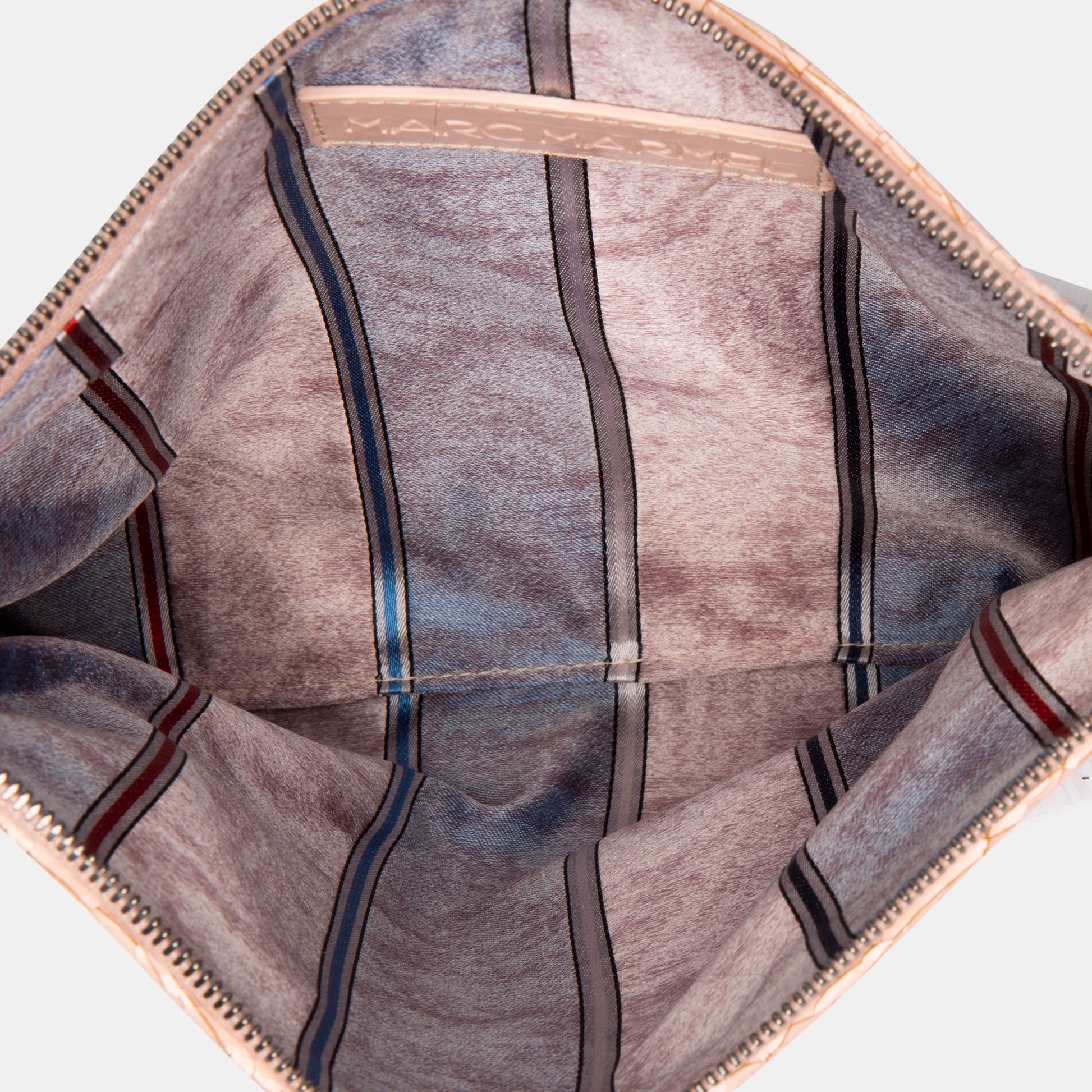 Luxury leather sustainable silk rectangular pouch encased in ecofriendly polyurethane.