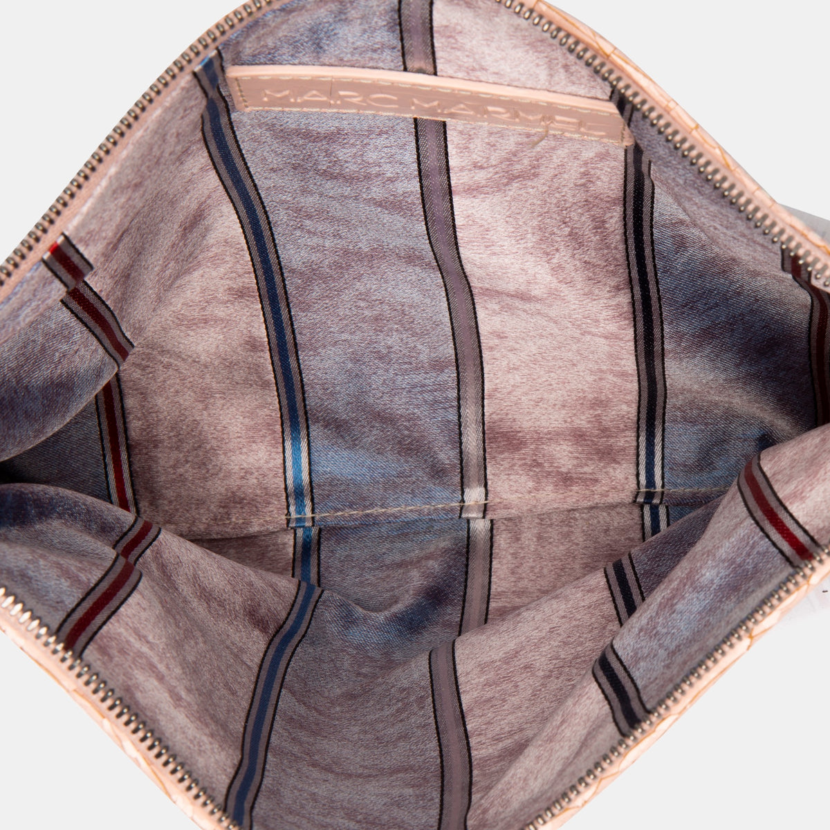 Luxury leather sustainable silk rectangular pouch encased in ecofriendly polyurethane.