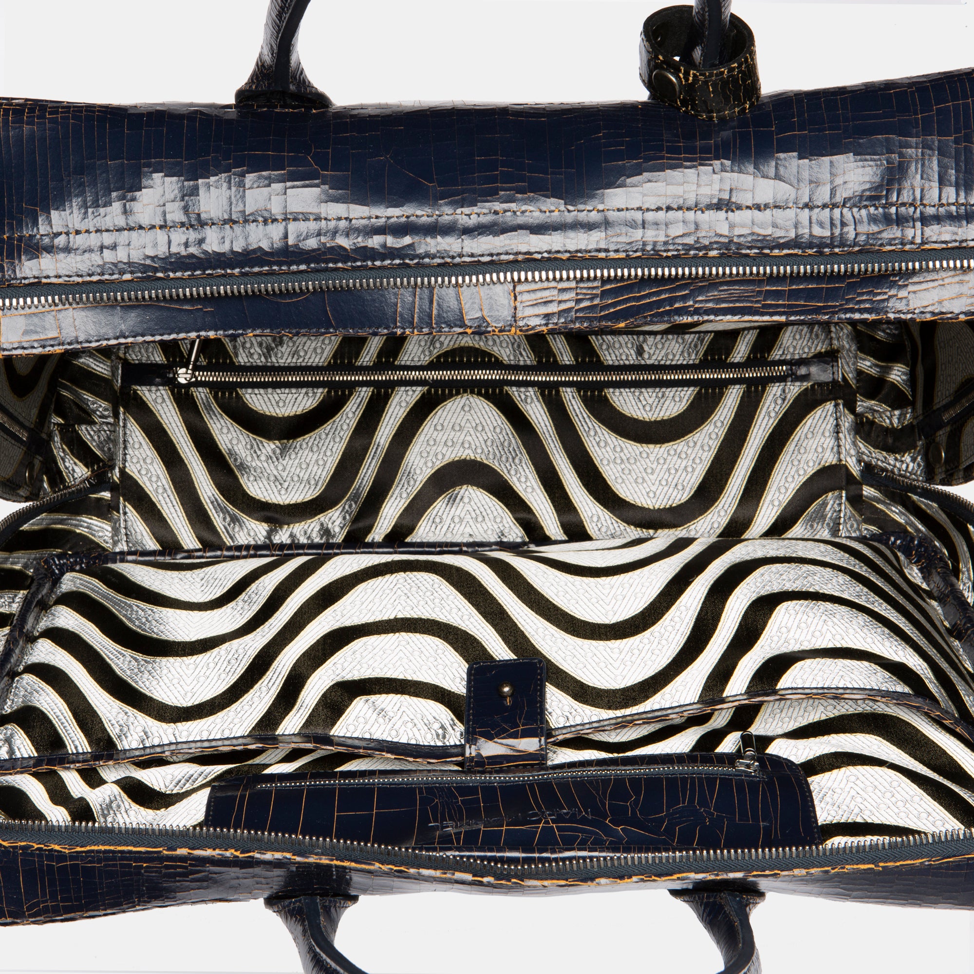 Marc Marmel Midi Benny Bag Luggage in navy leather with sturdy handles and a sleek, compact design for stylish travel.