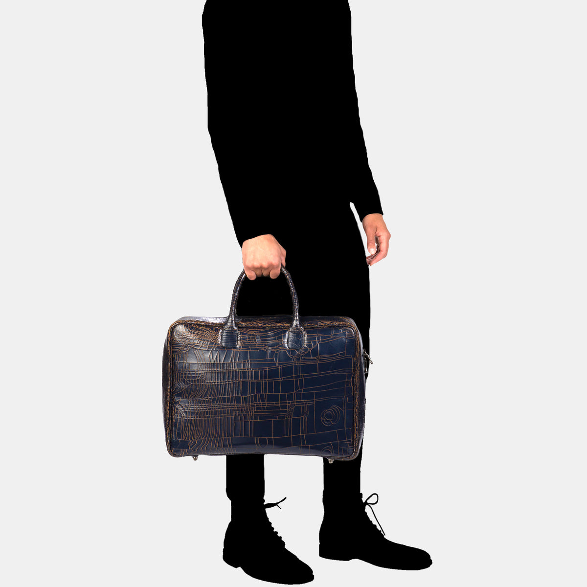 Marc Marmel Midi Benny Bag Luggage in luxury navy leather, showing a stylish, compact travel bag with handle and zipper closure.