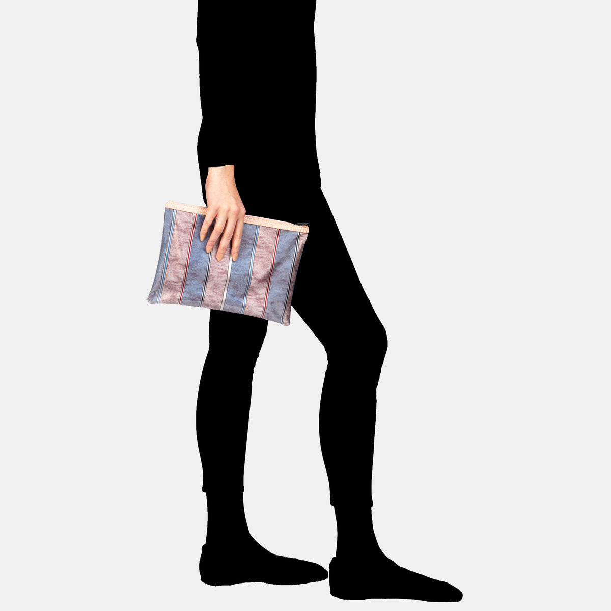Luxury leather sustainable silk rectangular pouch encased in ecofriendly polyurethane.