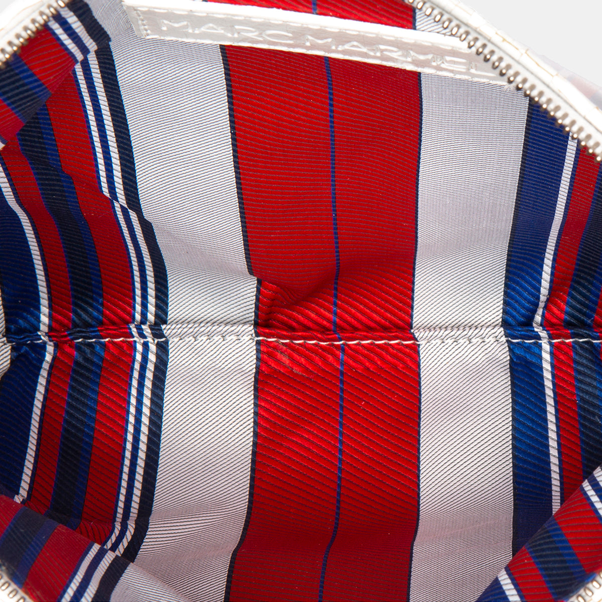 Luxury leather sustainable silk rectangular pouch encased in ecofriendly polyurethane.